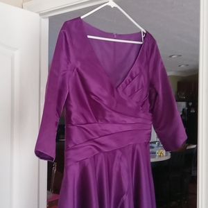 Two chiffon mid length gowns color purple size 14 new asking 200.00 dollars
